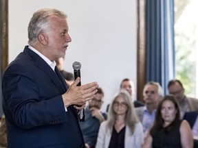 Quebec Premier Philippe Couillard speaks to anglo leaders at Dawson College on Thursday, Aug. 16, 2018.