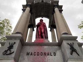 Vandals have defaced John. A. Macdonald statue in Place du Canada, seen in Montreal on Friday August 17, 2018. (Allen McInnis / MONTREAL GAZETTE) ORG XMIT: 61236