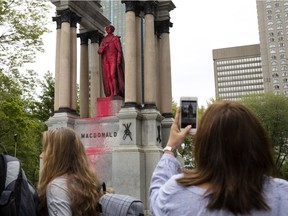 Vandals have defaced John. A. Macdonald statue in Place du Canada, seen in Montreal on Friday August 17, 2018.