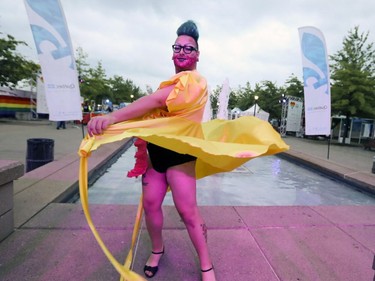 Anastasia welcomes festival goers at the entrance to Pride festivities in Montreal on Friday, August 17, 2018.