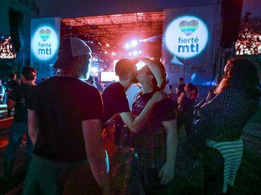 People listen and dance to DJ Frigid during Pride festivities in Montreal on Friday, August 17, 2018.