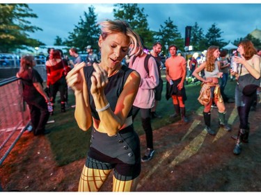 Catherine Servedio dances to the beats of DJ Frigid during Pride festivities in Montreal on Friday, August 17, 2018.