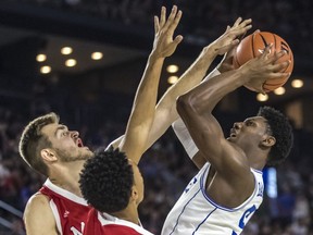 NCAA powerhouse Duke Blue Devils played an exhibition game against the McGill Redmen at Place Bell in Laval on Sunday, August 19, 2018. McGill's Noah Daoust, left, and Isaiah Cummins defend against Duke's R.J. Barrett, who is likely going to be a top pick in the NBA draft.