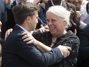 Québec solidaire party spokesperson Manon Massé and Gabriel Nadeau-Dubois share a hug in the riding of Laurier-Dorion on Aug. 23, 2018, the first day of the provincial election campaign.
