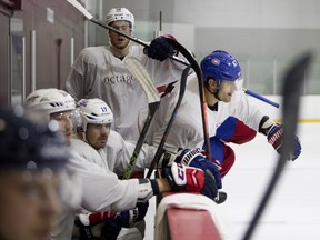 Canadiens' Max Pacioretty climbs over the boards as he takes part in the Octagon hockey scrimmage in Montreal on Friday, Aug. 24, 2018.