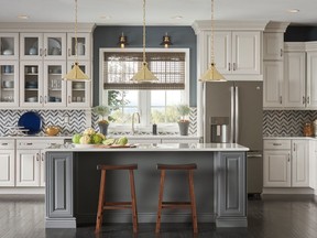 Thomasville's Camden kitchen island in a trend-setting fossil grey finish adds additional work surface and looks like a separate piece of furniture in a neutral kitchen.