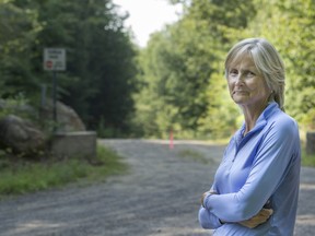 Corry Terfloth stands near one of the entry roads to a proposed housing project on Chemin du Fief in St-Lazare.