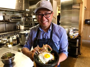 Antonio Park with a soft-shell crab bibimbap, made with crab from La Mer and vegetables from Park’s rooftop garden. Park shares his South Korean and South American backgrounds in his kitchens. But, he says, “You don’t have to understand the culture to make the food. Just opening yourself up to other cultures and trying something different, that’s where we will find unity.”