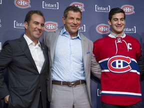 Happier times: Montreal Canadiens GM Marc Bergevin is flanked by team owner Geoff Molson and captain Max Pacioretty at the Bell Sports Complex in Brossard on Sept. 18, 2015.