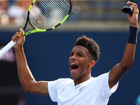 Félix Auger-Aliassime of Canada, celebrates victory over Lucas Pouille of France following a 1st round match on Day 2 of the Rogers Cup at Aviva Centre on Aug. 7, 2018 in Toronto.