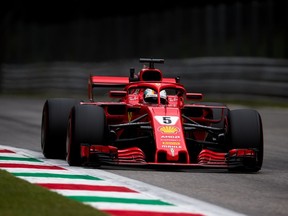Ferrari's Sebastian Vettel posted the fastest lap time during Friday afternoon practice for the Italian Grand Prix at Autodromo di Monza.