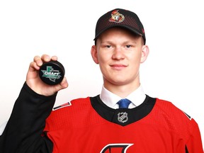 Brady Tkachuk poses after being selected fourth overall by the Ottawa Senators during the first round of the 2018 NHL Draft at American Airlines Center on June 22, 2018 in Dallas, Texas.