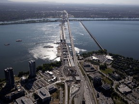 The new Champlain Bridge begins to take shape next to the existing bridge as seen from the Montreal side in July 2018.