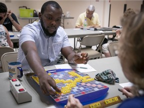Olakunle Azeez Omopariola takes part in a Scrabble match in Côte St-Luc on Aug. 15, 2018.