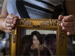 Françoise Algier, mother of Mélina Martin, holds a picture of her daughter taken the month before she went missing.