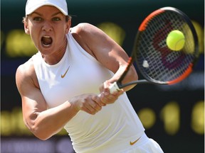 Romania's Simona Halep returns to Taiwan's Hsieh Su-Wei in their women's singles third round match on the sixth day of the 2018 Wimbledon Championships at The All England Lawn Tennis Club in Wimbledon, southwest London, on July 7, 2018.
