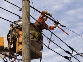 Hydro-Quebec crews repair power lines.
