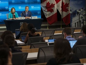 Stephen Poloz, governor of the Bank of Canada, right, and Carolyn Wilkins, senior deputy governor, announcing the July interest rate increase.