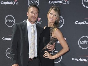 In this July 17, 2013, file photo, Skier Bode Miller, left, and his wife, Morgan Miller, arrive at the ESPY Awards in Los Angeles.