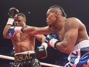 Jean Pascal, left, from Montreal, takes a right to the head from Eleider Alvarez, from Columbia, in 12th round action of their light heavyweight fight on in Montreal on June 3, 2017. After more than three years of waiting in vain for Adonis Stevenson, Montreal-based Eleider Alvarez will finally get a shot at a world title -- against Sergey (Krusher) Kovalev. The Colombian-born Alvarez (23-0) will try to wrest the World Boxing Association light heavyweight title from Kovalev (32-2-1) on Aug. 4 in Atlantic City.