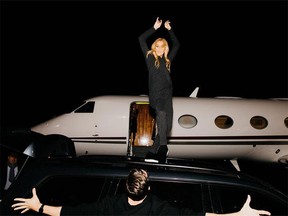 Céline Dion dancing on top of a car after disembarking from a private jet...as one does.