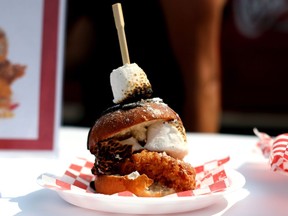 A s'more fried chicken sandwich is shown in this undated handout photo. Chocolate-banana steak eclairs, pickle ice cream, fried frog legs and s'more fried chicken sandwiches are among crazy gastronomic concoctions revealed before the Canadian National Exhibition (CNE) opens in Toronto on Friday. The annual summer carnival is known for its wacky foods and this year's selection unveiled Wednesday is proving to be no different.