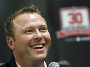 FILE - In this Feb. 9, 2016, file photo, former New Jersey Devils star goalie Martin Brodeur smiles as he talks about his career with the Devils during a news conference announcing the Devils will retire Brodeur's No. 30 jersey, in Newark, N.J. Brodeur is returning to the New Jersey Devils as executive vice president of business development. Brodeur is back with the franchise he led to the Stanley Cup three times and became the NHL's all-time-leading goaltender in victories. The 46-year-old shifts to the business side after three years in hockey management as assistant general manager of the St. Louis Blues. The Devils announced Brodeur's hire Wednesday, Aug. 29, 2018, not long after the Blues said he left the organization.