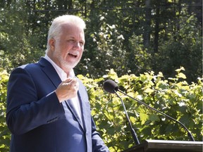Philippe Couillard's Liberal Party holds 68 of the 125-seat National Assembly going into the election set for Oct. 1