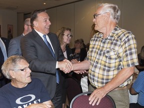 CAQ Leader François Legault greets supporters during a campaign stop at a seniors' facility in Salaberry-de-Valleyfield on Friday, August 24, 2018.