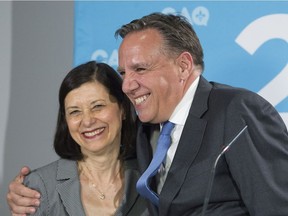 CAQ Leader François Legault hugs Danielle McCann after announcing her as a candidate for Sanguinet during a press conference while on a campaign stop in Châteauguay on Friday, August 24, 2018.