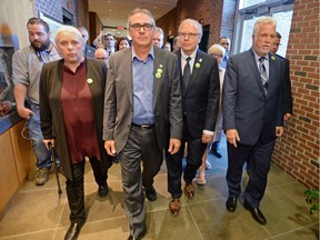 Quebec Solidaire co-spokesperson Manon Masse, left to right, UPA president Marcel Groleau, PQ leader Jean-Francois Lisee and Quebec Liberal Leader Philippe Couillard arrive for a joint press conference in Longueuil, Que. on Friday, August 31, 2018.