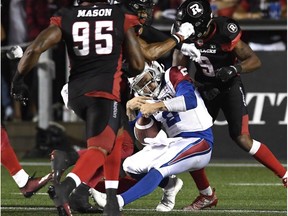 Montreal Alouettes quarterback Johnny Manziel is tackled by the Ottawa Redblacks during second half CFL action in Ottawa on Saturday, Aug. 11, 2018.