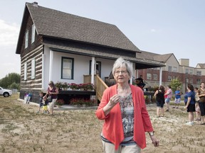 Annette Dionne, one of the two surviving Dionne quintuplets, visits the original cabin she was born in, relocated to downtown North Bay next to the North Bay Museum on Sunday, August 5, 2018.