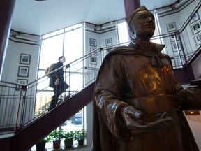 A statue of St. Ignatius of Loyola, founder of the Jesuit order, overlooks the Hall of Merit at Loyola High School in Montreal.