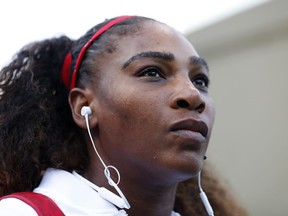 FILE - In this Tuesday, July 31, 2018, file photo, Serena Williams, of the United States, waits to walk onto the court before the match against Johanna Konta, from Britain, during the Mubadala Silicon Valley Classic tennis tournament in San Jose, Calif. Williams says she's been struggling with postpartum emotions and wants other new moms to know they are "totally normal."
