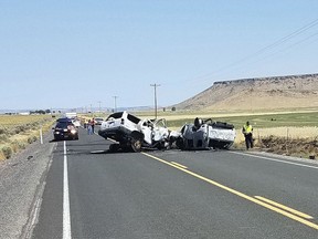 This Monday, Aug. 13, 2018 photo provided by the Oregon State Police shows the scene of a fatal car crash outside Burns, Ore. The collision in rural Oregon that killed eight people happened when the driver of one SUV crossed the centerline and crashed into another SUV carrying seven people. All the victims died at the scene.