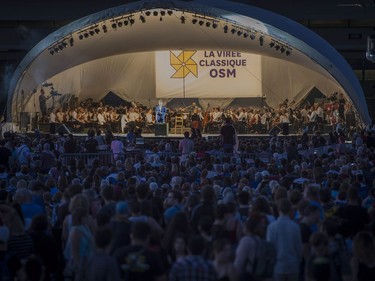 The OSM performs a Free outdoor concert at the Olympic Park in Montreal, on Wednesday, Aug. 29, 2018. The orchestra kicks off its annual Classical Spree mini-festival with a show featuring circus artists from Cirque Eloize and recitations by Emmanuel Bilodeau.