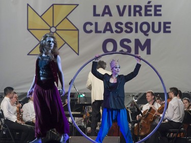 The OSM performs a Free outdoor concert at the Olympic Park in Montreal, on Wednesday, Aug. 29, 2018. The orchestra kicks off its annual Classical Spree mini-festival with a show featuring circus artists from Cirque Eloize and recitations by Emmanuel Bilodeau.