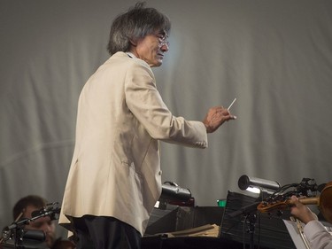 Kent Nagano conducts the OSM as they perform a free outdoor concert at the Olympic Park in Montreal, on Wednesday, Aug. 29, 2018. The orchestra kicks off its annual Classical Spree mini-festival with a show featuring circus artists from Cirque Eloize and recitations by Emmanuel Bilodeau.