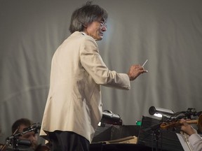 Kent Nagano conducts the OSM during an outdoor concert at Olympic Park on Wednesday, Aug. 29, which preceded this weekend’s Classical Spree festival.