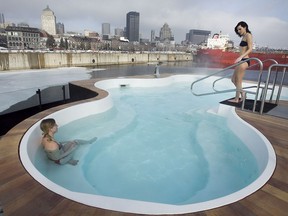 Emily Holman (L) and Caroline Tremblay enjoy the spa and the Montreal skyline at the Bota Bota floating spa in Old Montreal on Thursday March 17, 2011.