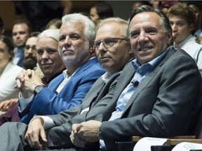 Québec Solidaire spokesperson Manon Massé, left to right, Quebec Premier Philippe Couillard, Parti Québécois Leader Jean-François Lisée and CAQ Leader François Legault participate in a youth-oriented event at Concordia University on Friday night.