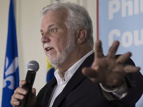 Quebec Liberal Leader Philippe Couillard speaks to supporters in St-Félicien, on Sunday, Aug. 26, 2018 .