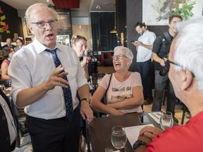 PQ leader Jean-François Lisée shares a laugh with supporters during a campaign stop in Chambly on Friday, August 24, 2018.