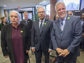 Québec solidaire co-spokesperson Manon Massé, Parti Québécois Leader Jean-François Lisée, centre, and Quebec Liberal Leader Philippe Couillard arrive for a joint news conference in support of Quebec farmers in Longueuil on Friday, August 31, 2018.