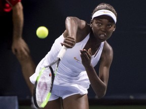 Montreal's Françoise Abanda serves to Belgium's Kirsten Flipkens Tuesday night at IGA Stadium.