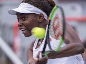 Francoise Abanda of Canada returns to Sloane Stephens of the United States during second round of play at the Rogers Cup tennis tournament, Wednesday August 8, 2018 in Montreal.