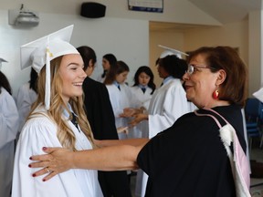 Nancy Sweer, head of school at The Study, with Mia Strack Van Schyndel, a member of the 2018 graduating class.