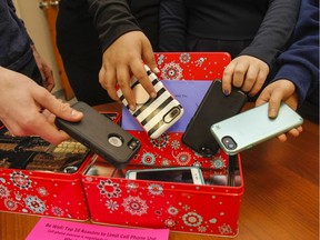 Students park their cellphones during a class.