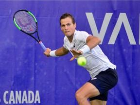 Vasek Pospisil of Vancouver returns a volley during his semifinal match against Daniel Evans of England at Hollyburn Country Club in West Vancouver on Saturday, Aug. 18, 2018. Evans beat the B.C. tennis star 3-6, 7-5, 6-2.